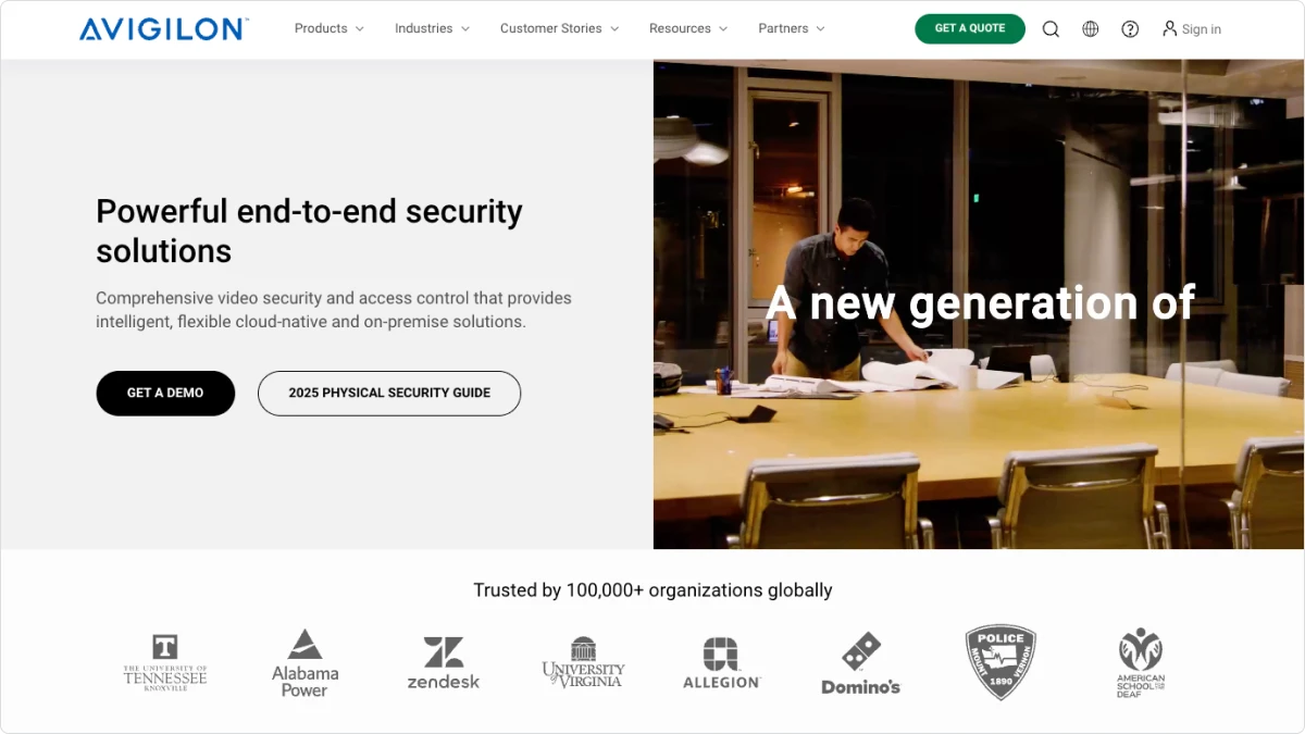 A man standing over a conference room table.