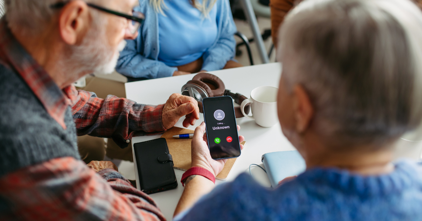 iphone and android phones showing 'scam likely' and 'suspected scam' warnings on phonecalls