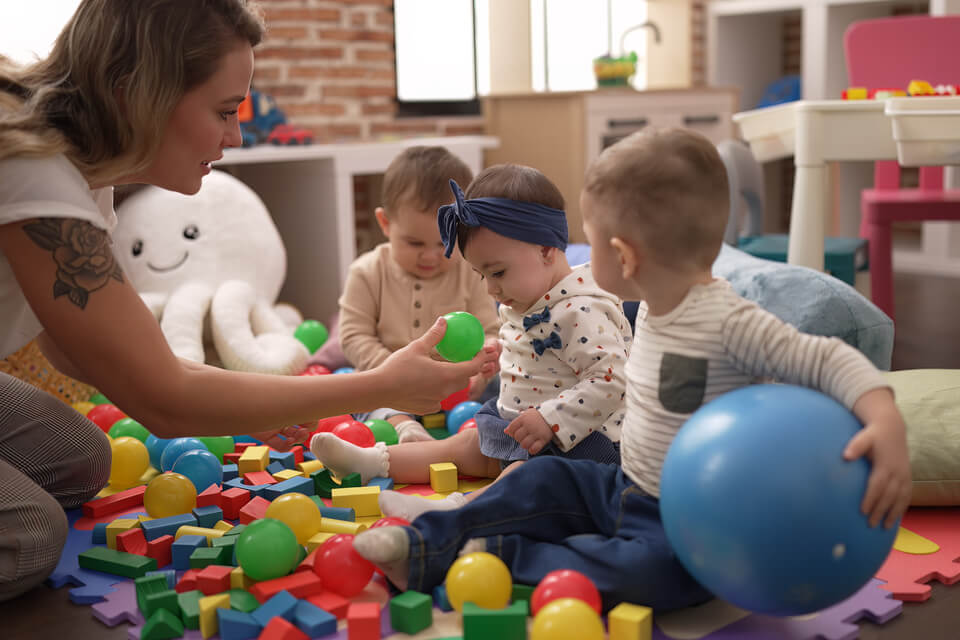Toddler playing ball at daycare