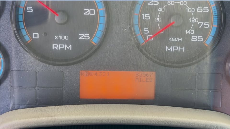 Instrument cluster showing 83,567 miles on the odometer