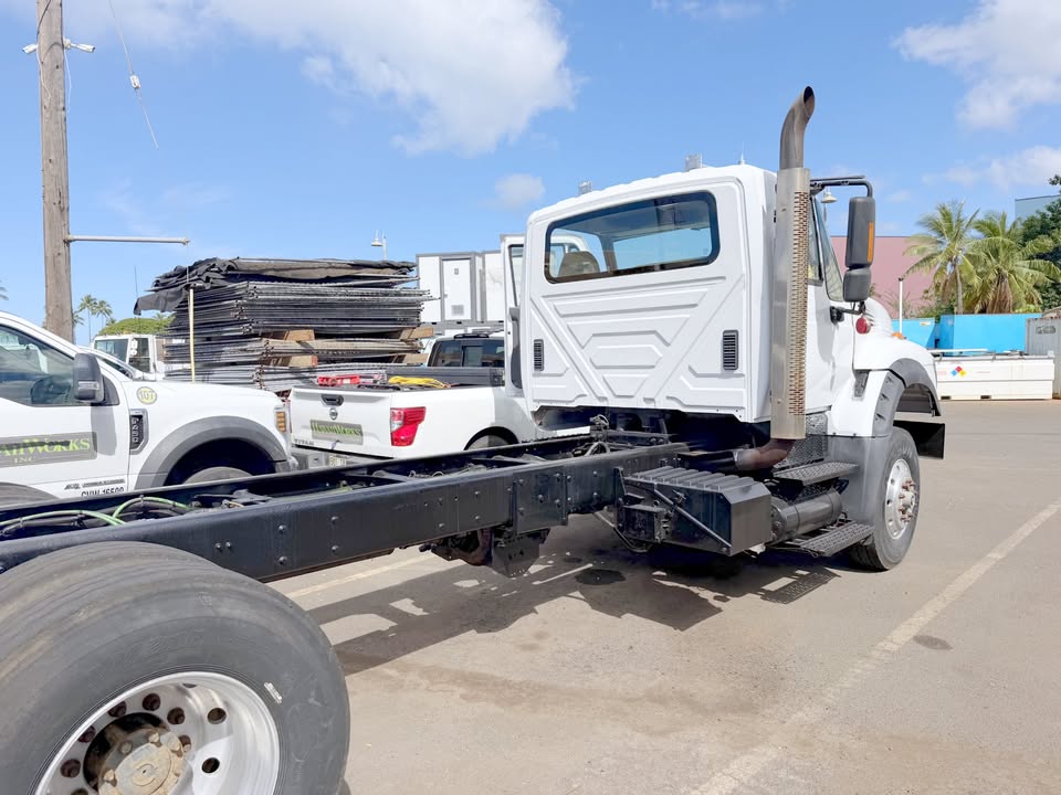 Rear three-quarter view showing the bare frame rails ready for a body