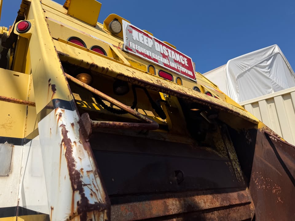 Raised tailgate and hydraulic packer blade on the 2011 International rear loader