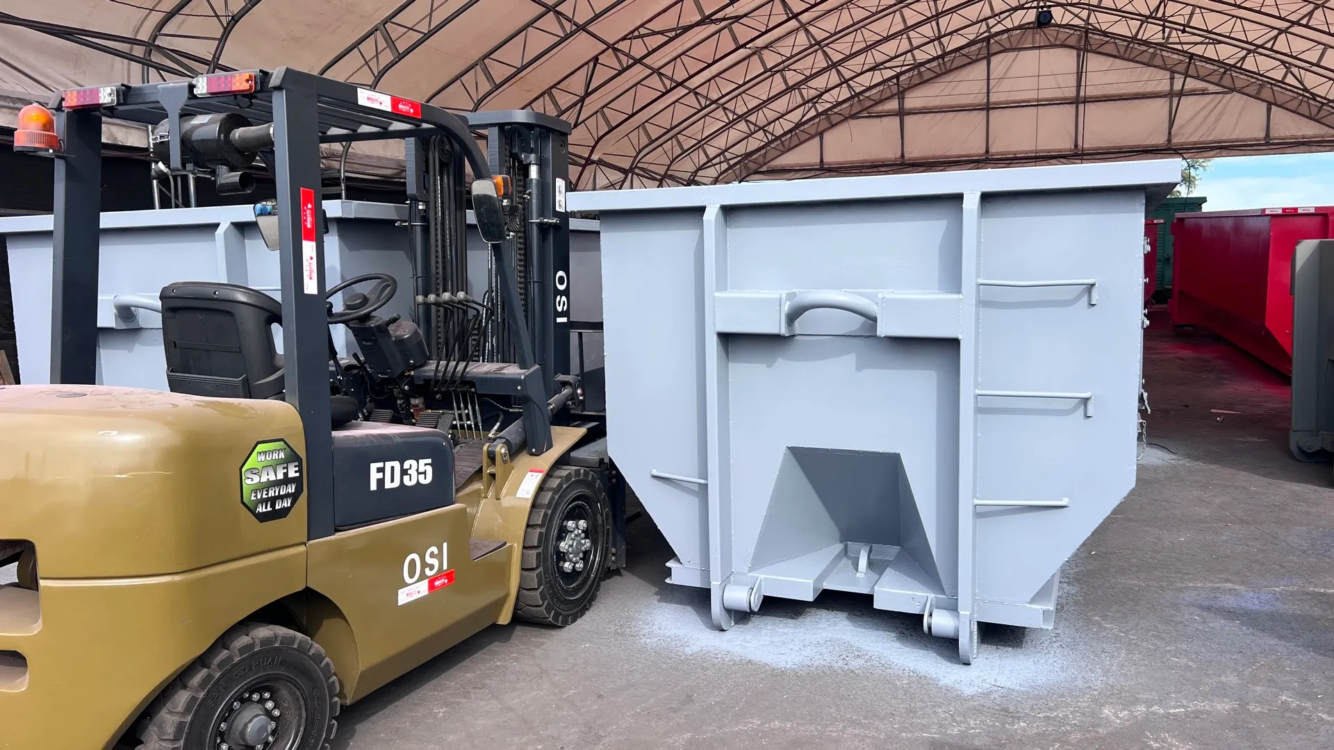 OSI FD35 diesel forklift with strobe lights and side shift beside a HIWASTE dumpster