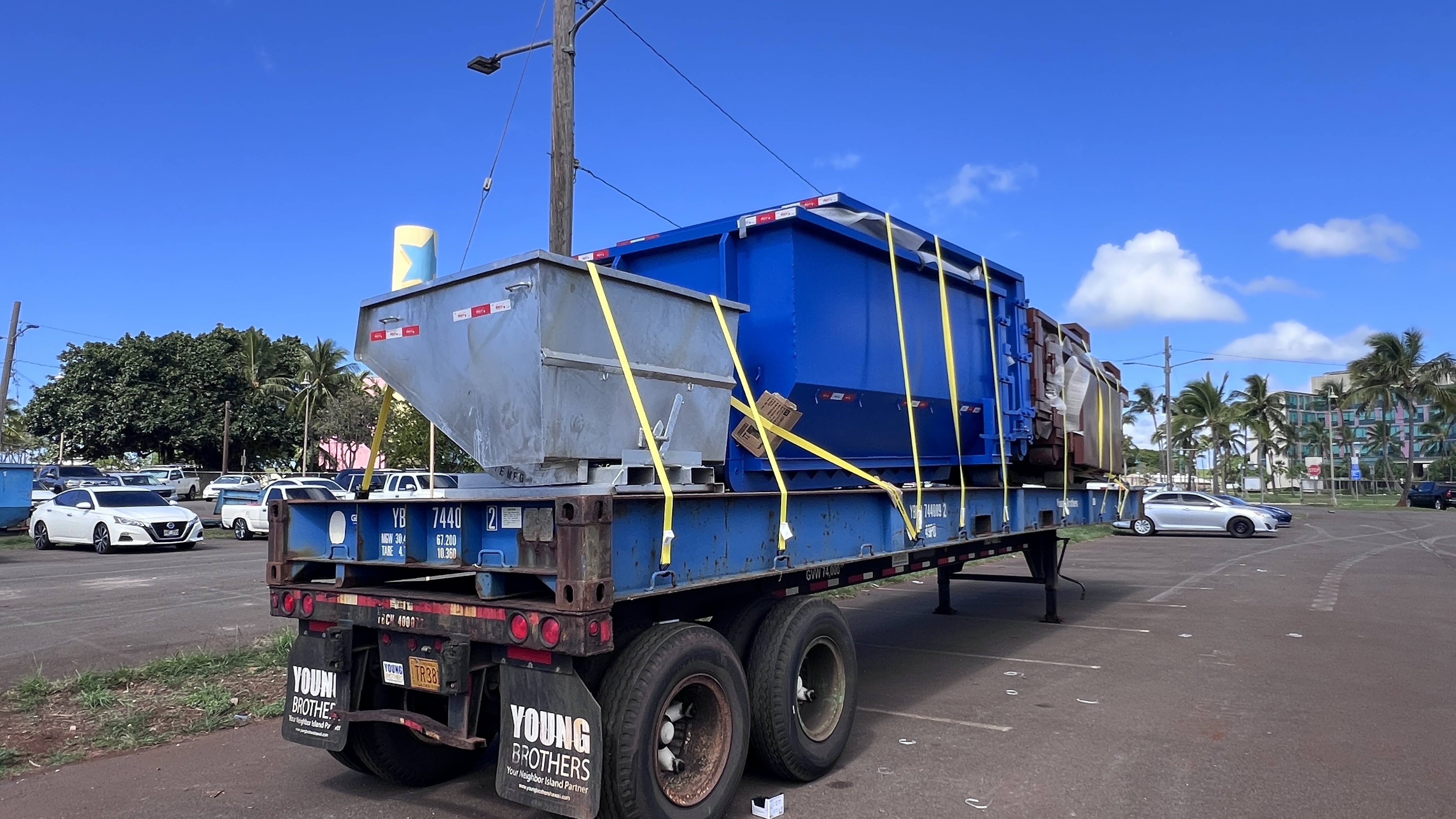 Dumpster loaded and secured for interisland shipping