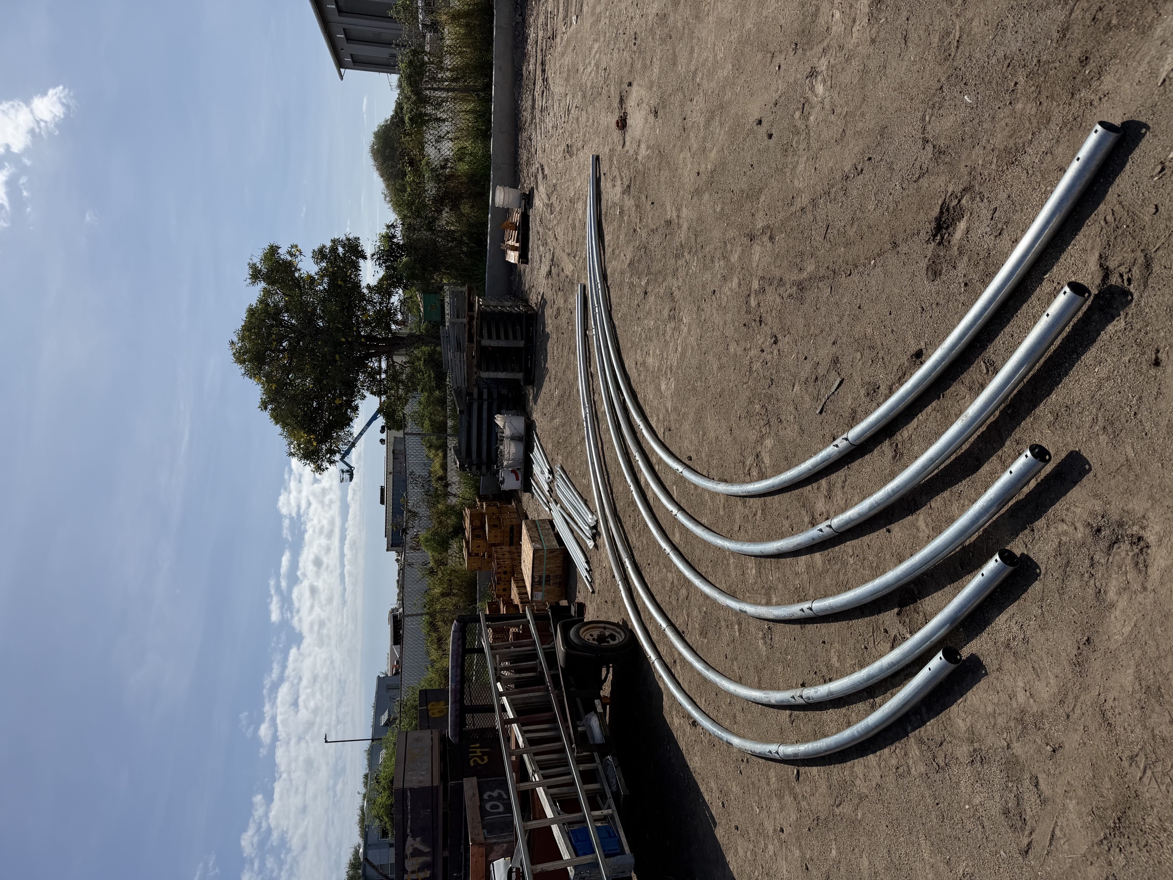 Truss pipes and materials staged for the container tent install