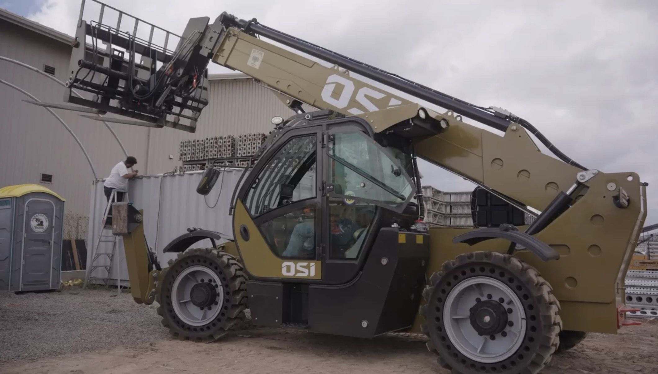 OSI telehandler boom extended at a job site