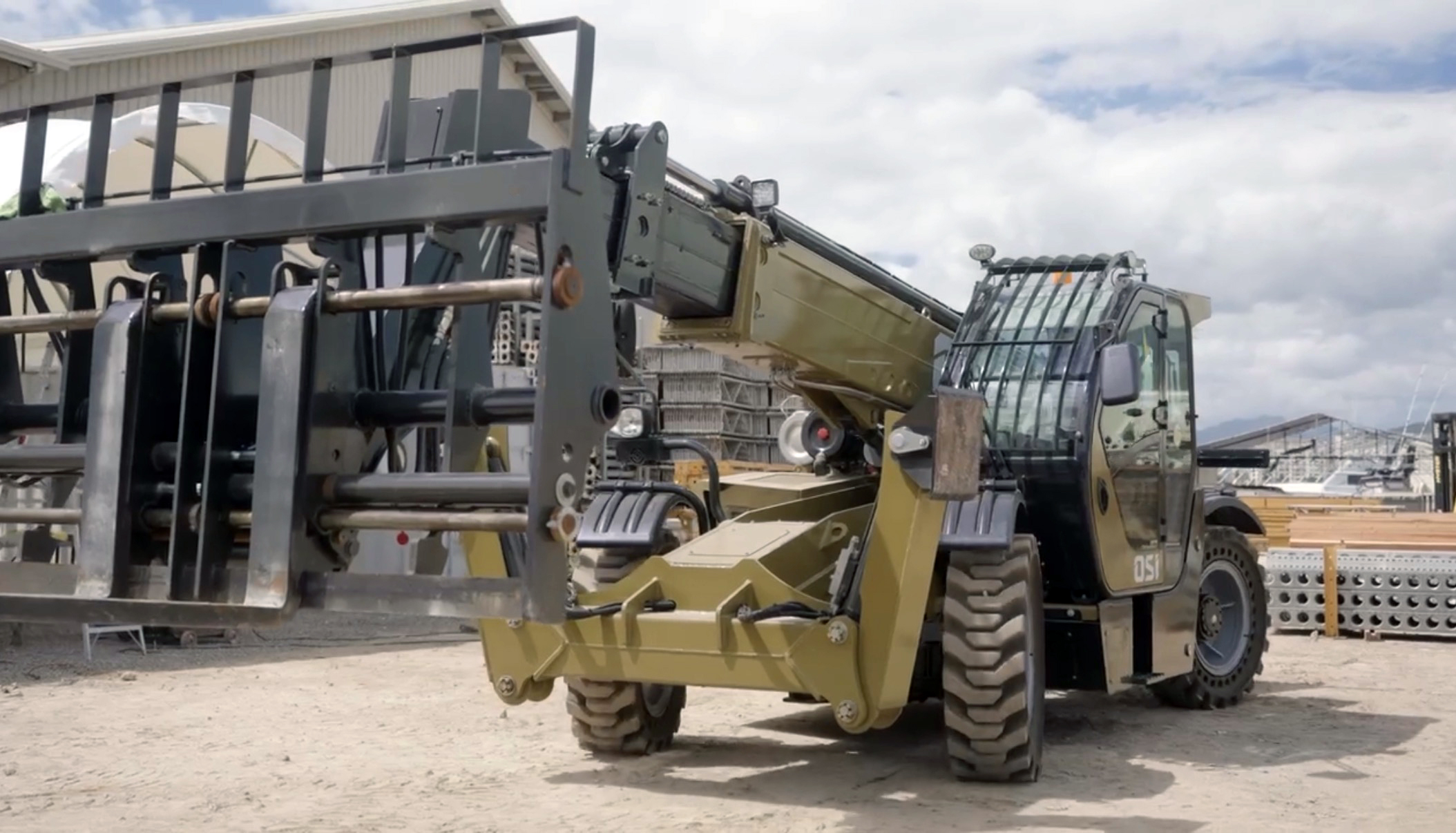 OSI telehandler lifting a pallet load