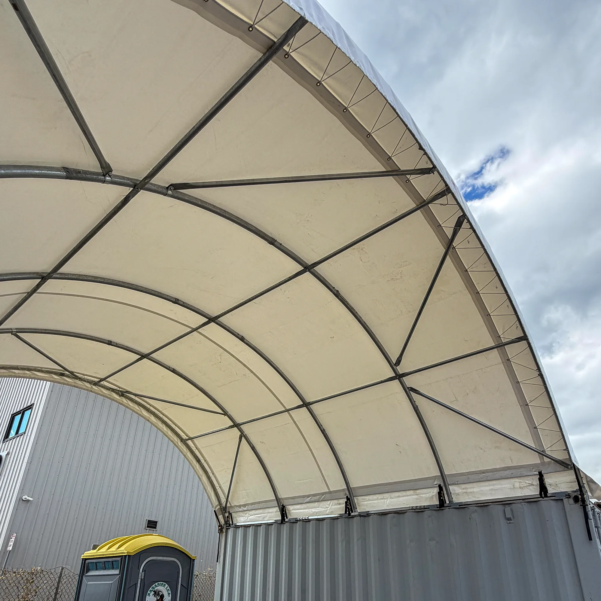20x20 container tent truss frame and tarp from below