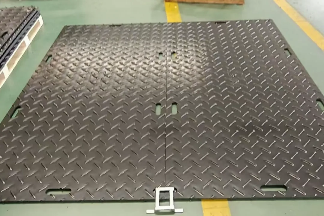 Two HDPE ground mats joined with a steel slip connector