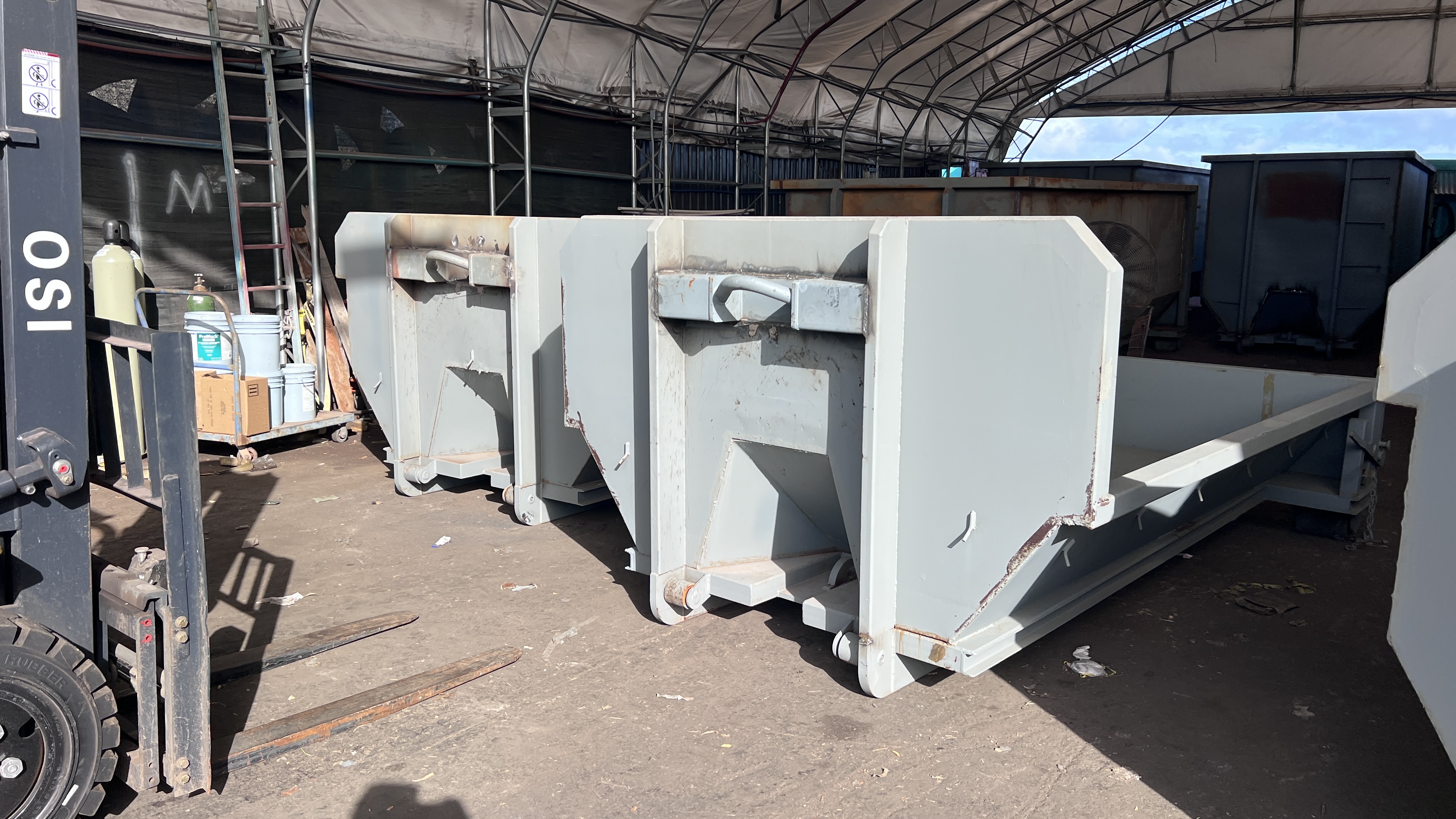 Dumpsters lined up in the shop during assembly