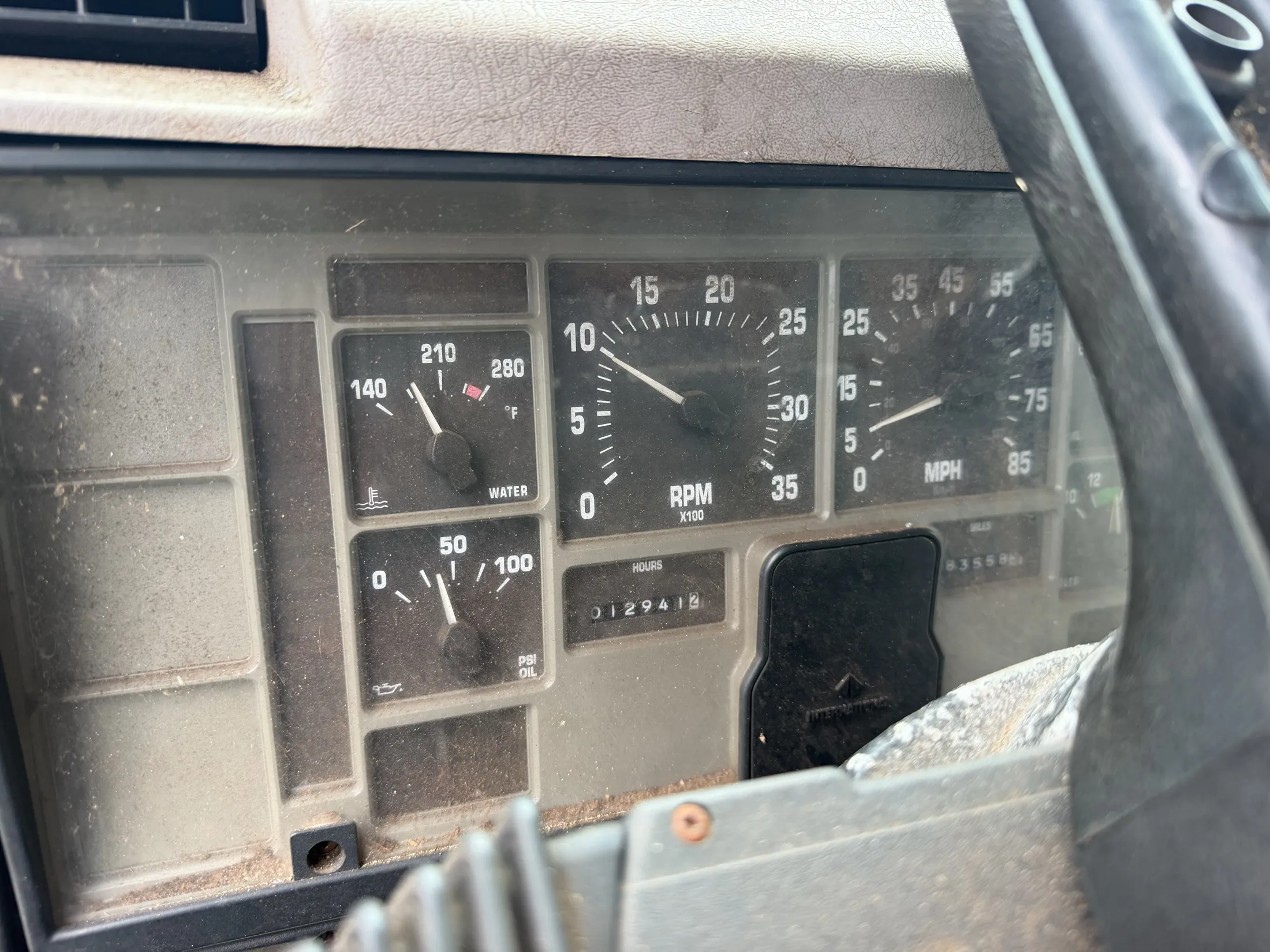 Instrument cluster with water temperature, oil pressure, tachometer, speedometer and hour meter