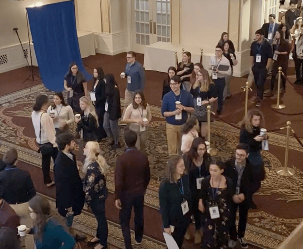 students walking through a hallway at a All Hands Israel campus event