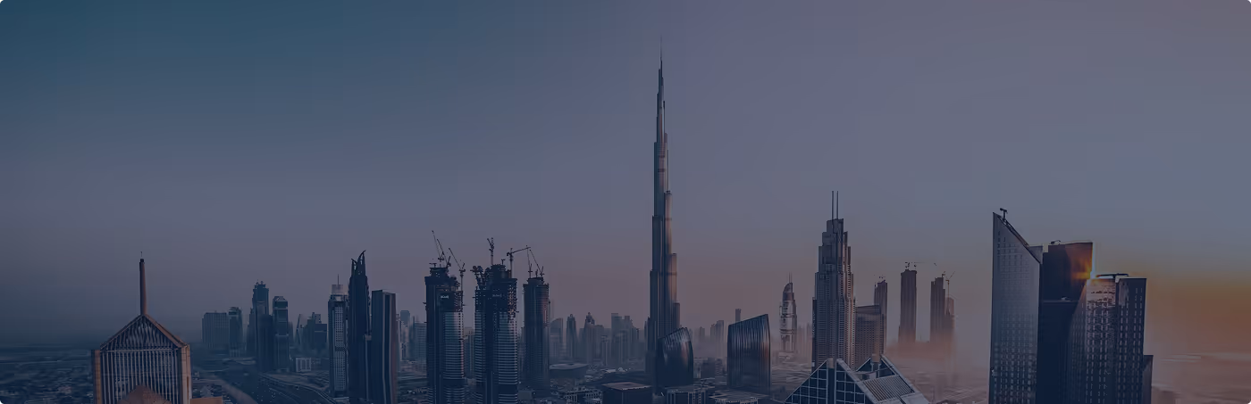 Skyline of Dubai at dusk featuring the Burj Khalifa and surrounding skyscrapers.