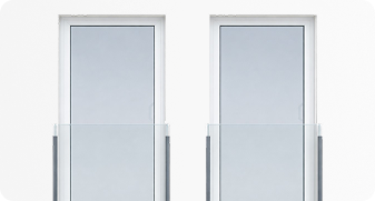 Two vertical glass display cases with grey backdrops, each holding a framed blank rectangular board.