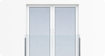 White double glass door with sleek handles and a transparent glass safety railing in front.