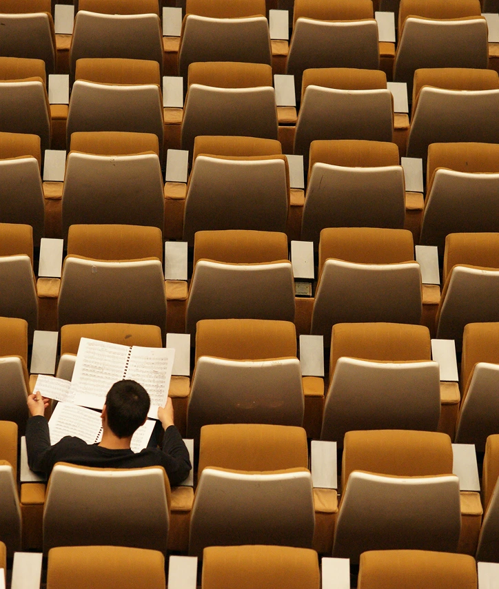 A student sitting an a chair