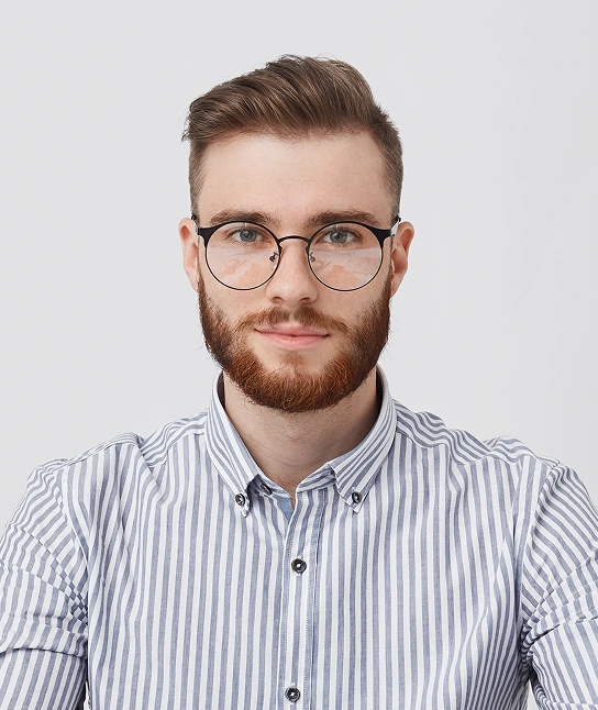 A guy wearing eyeglasses in a striped shirt