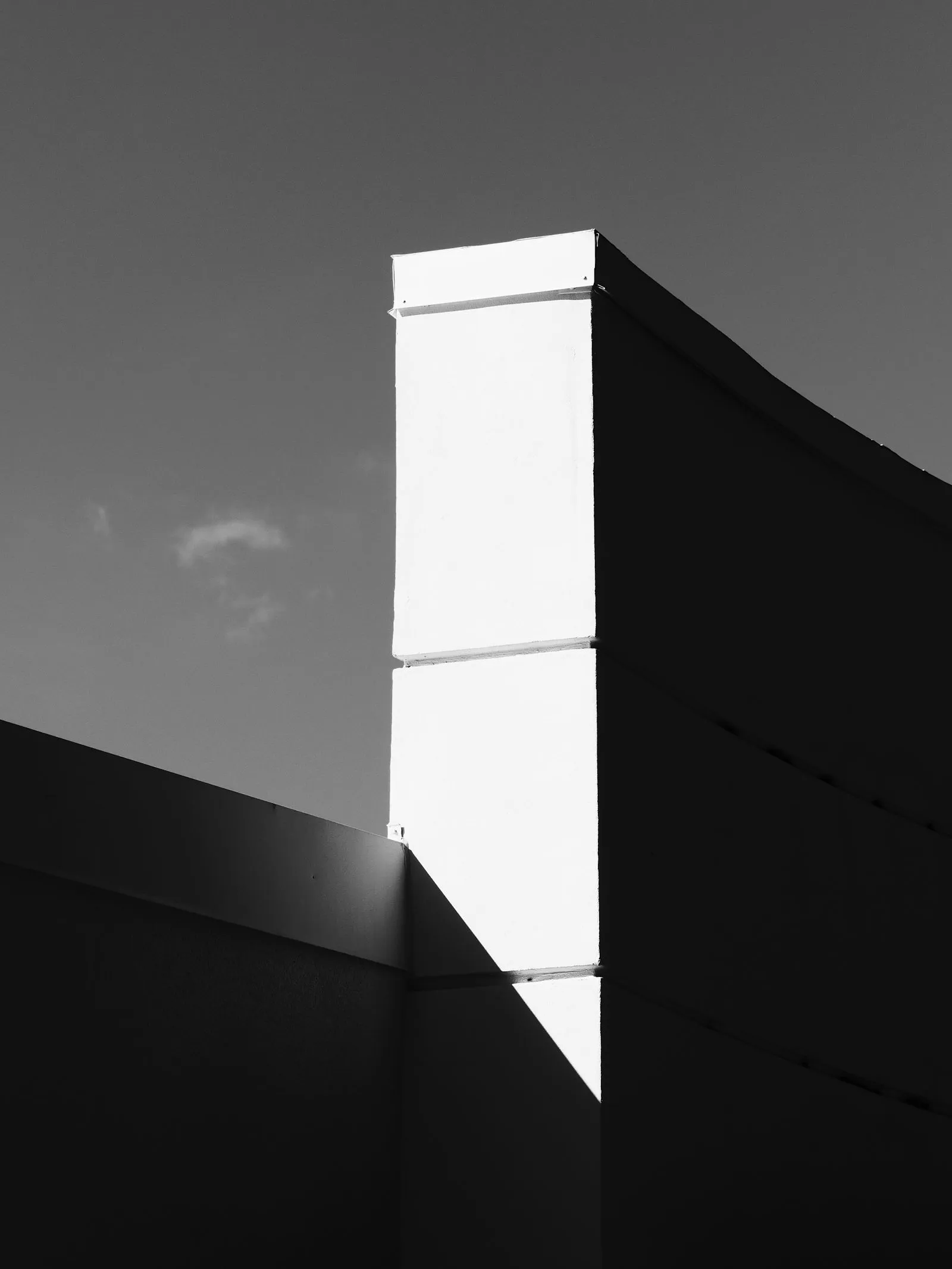 Modern building exterior with strong geometric shadows