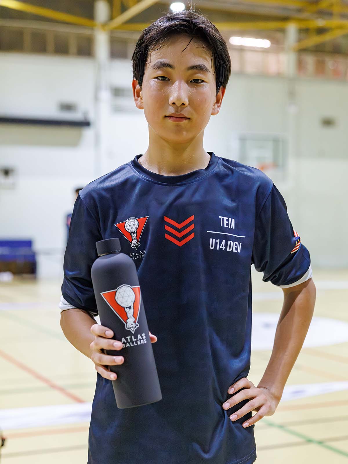 Atlas Ballers player holding the bottle on court