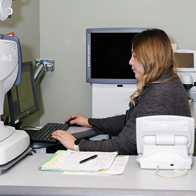 Woman working in the billing department of The Eye Center in Yakima.