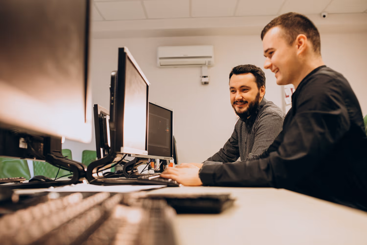 IT professionals monitoring systems together as a trusted IT partner
