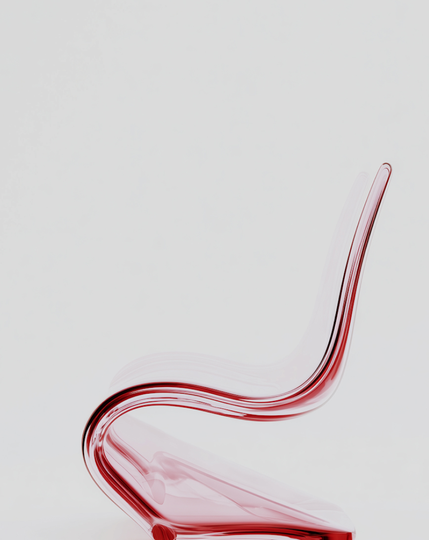 Modern transparent red chair with a curved design against a plain white background.