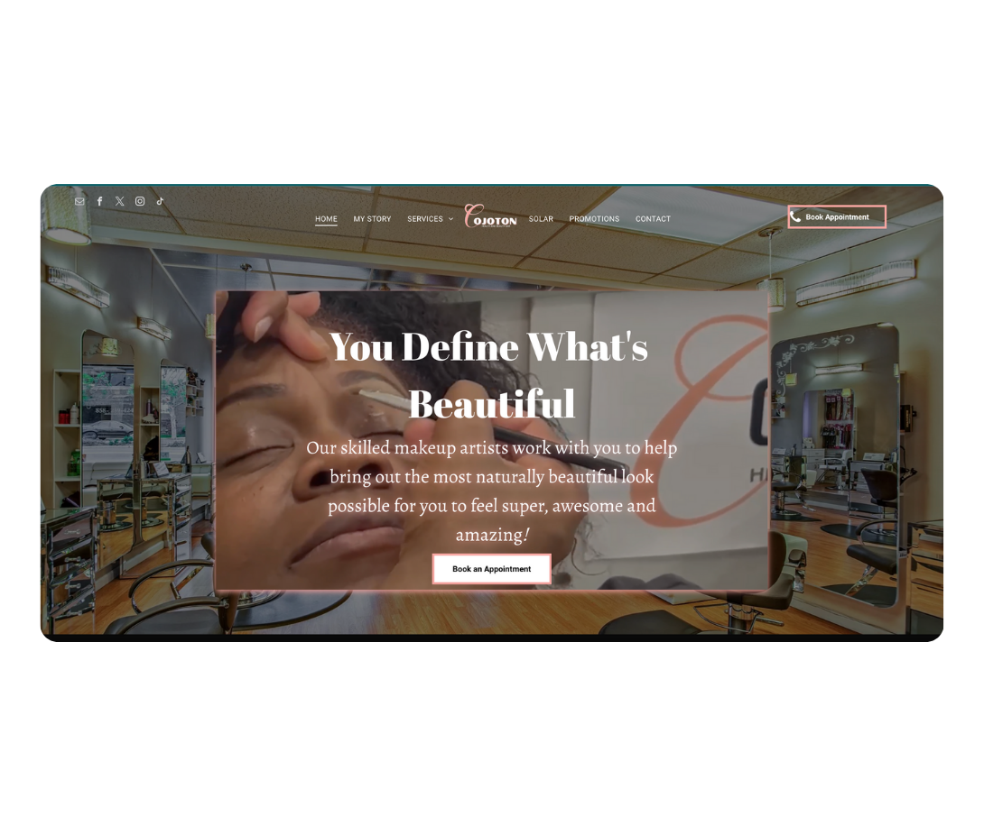 Makeup artist applying eyeshadow to a woman's closed eyes in a salon with mirrors and styling chairs.