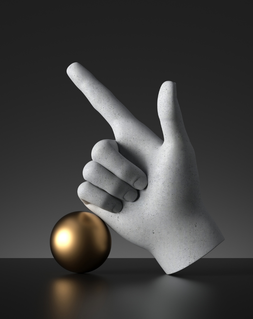 Sculpted stone hand in a gesture with index and thumb extended, resting on a reflective surface next to a shiny golden sphere.