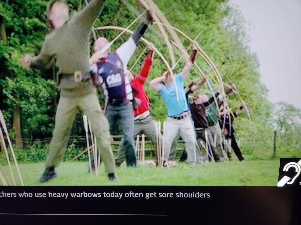 A picture containing text, grass, outdoor, sportDescription automatically generated