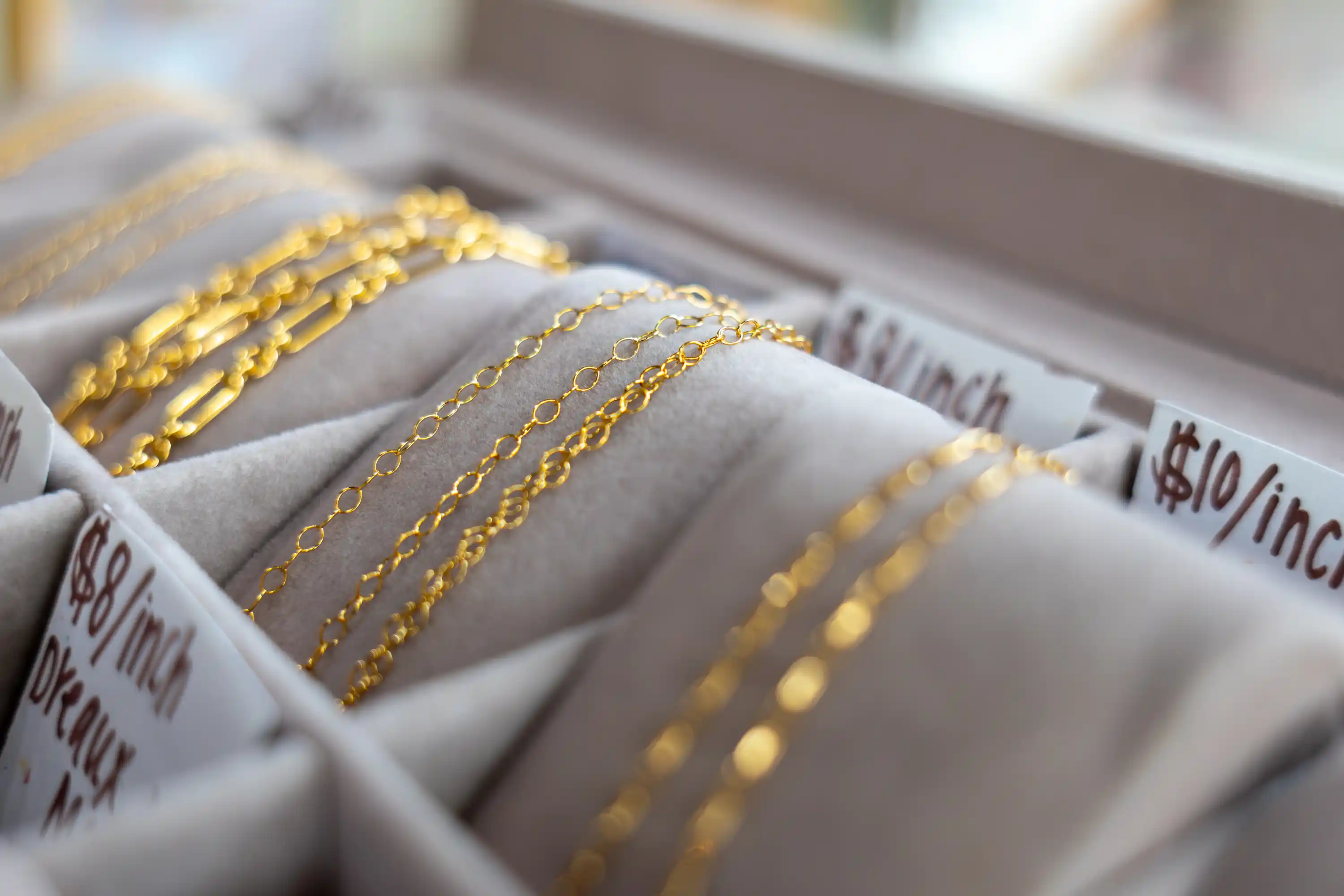 Permanent jewelry gold chains at Spruce Beauty Bar in Casper, Wyoming