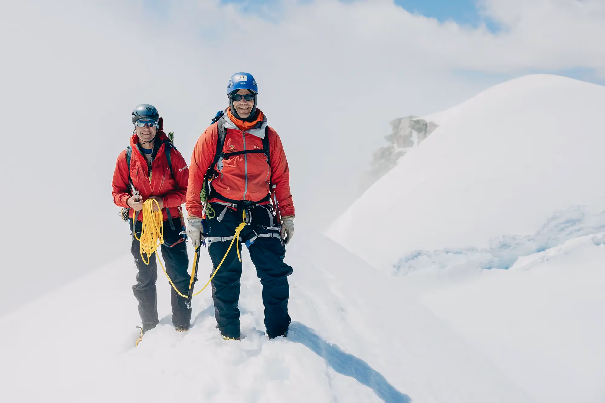 Guide and participant roped together on summit