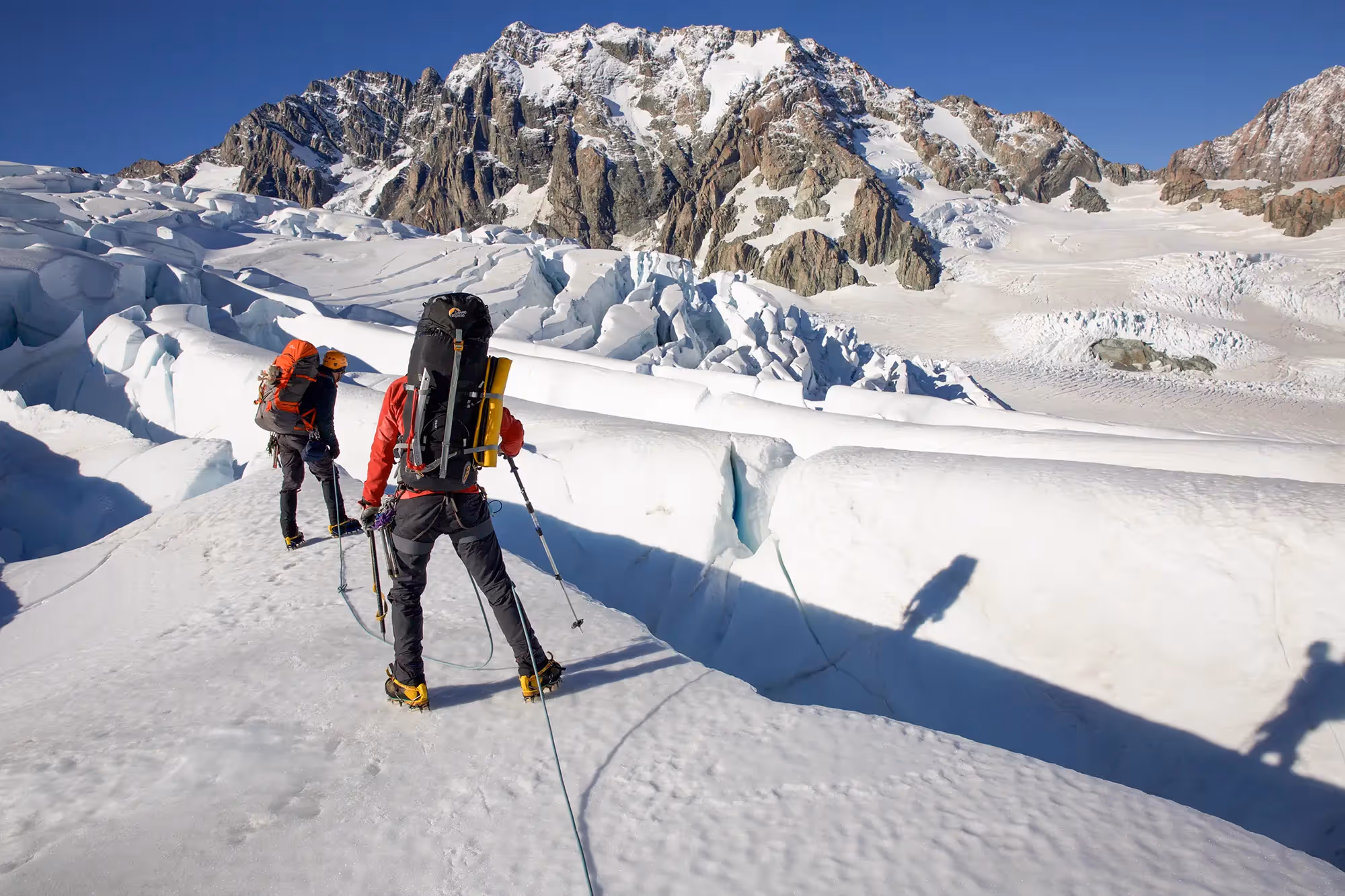Participants navigating crevasse terrain