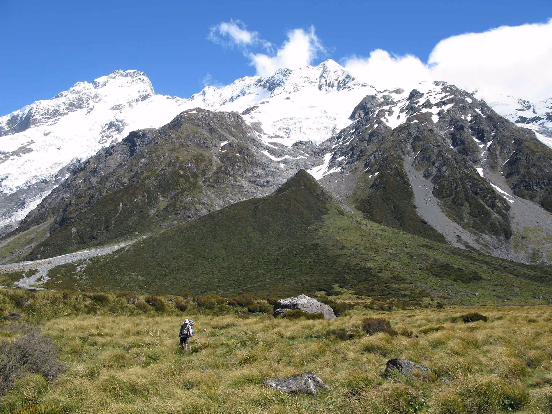 Footstool climb climbers walking through tussock field
