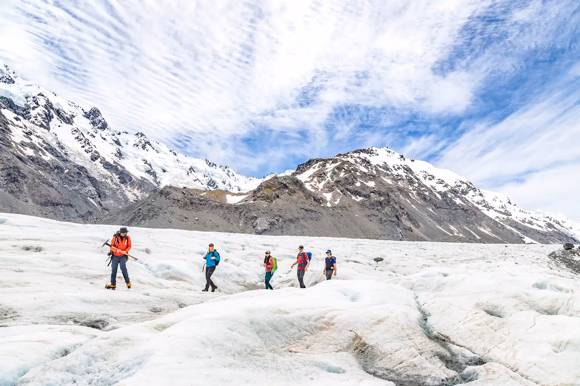 Guide and guests hiking on the Tasman Glacier
