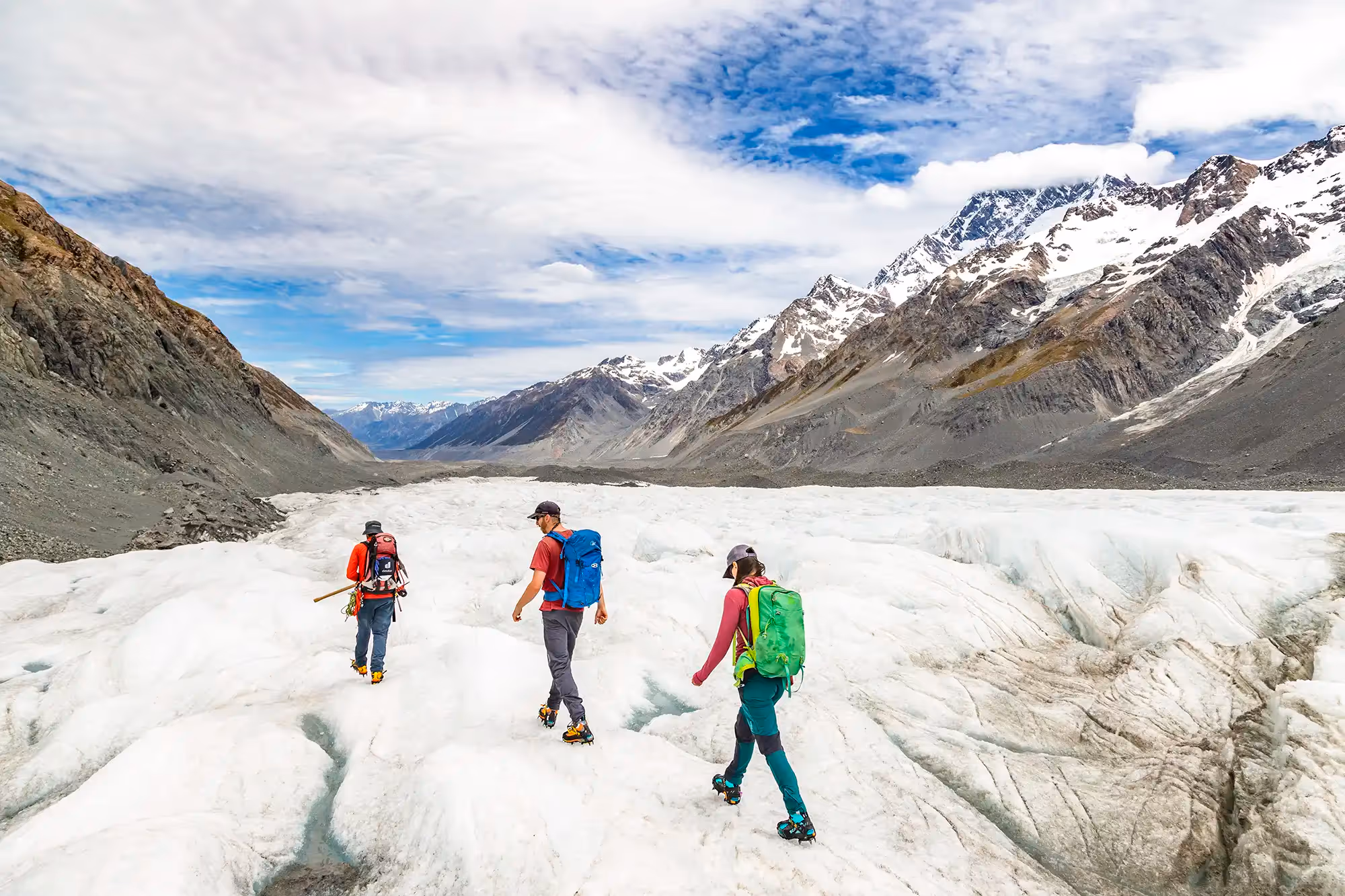 Guide and guests hiking on the glacier
