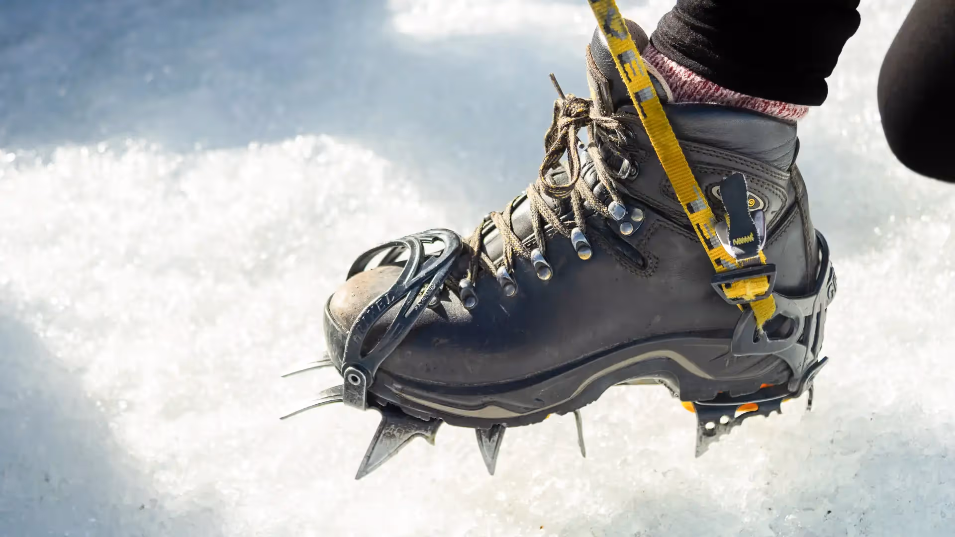 Tasman Glacier Helihike boots fitted with crampons on glacier ice
