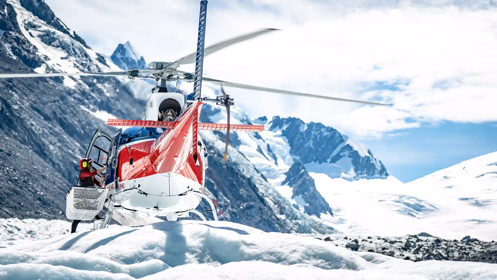 Helicopter lands on the Tasman Glacier ice