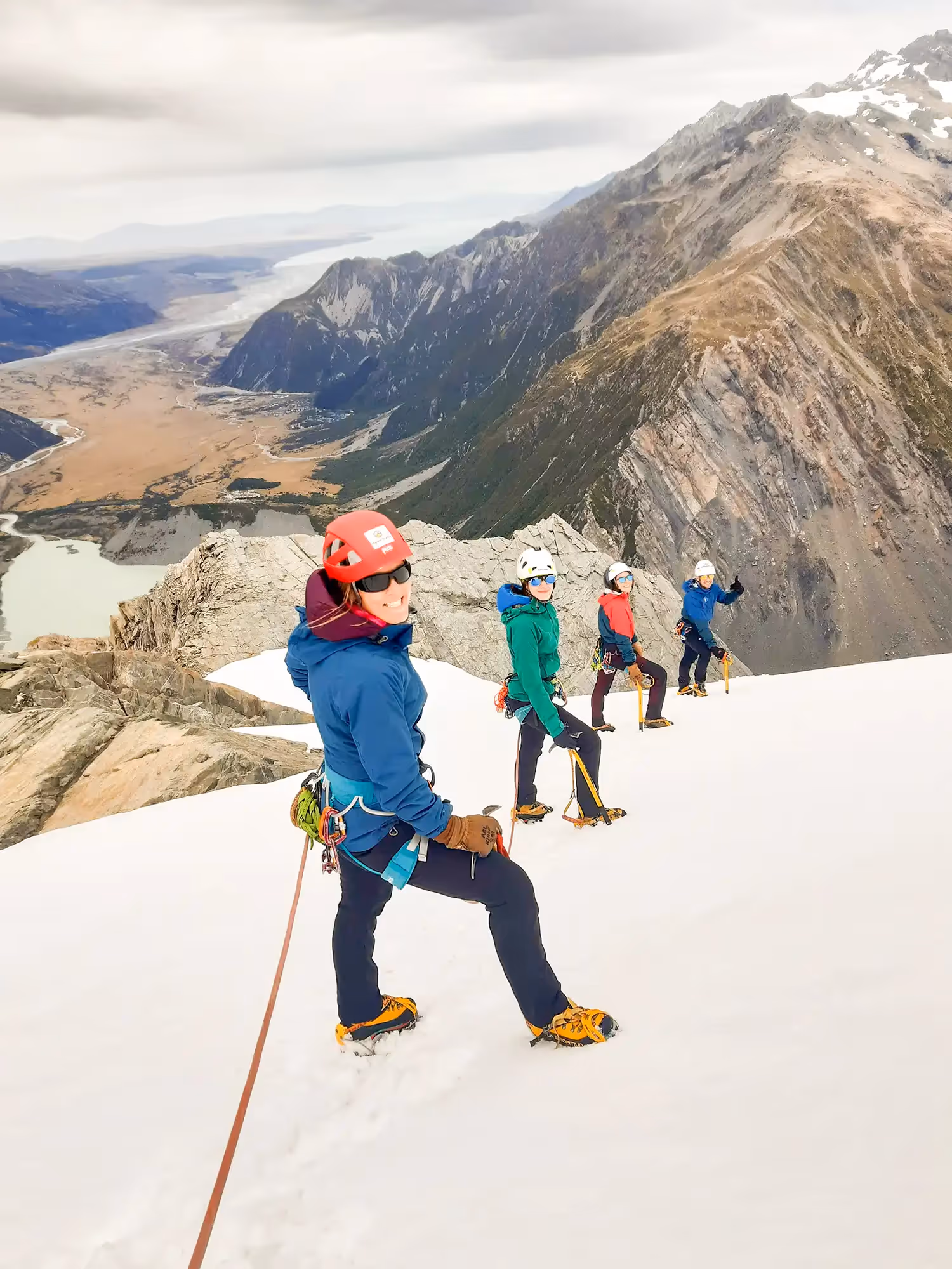 Mountain Experience Course group roped together as they ascend a snow-covered slope during training