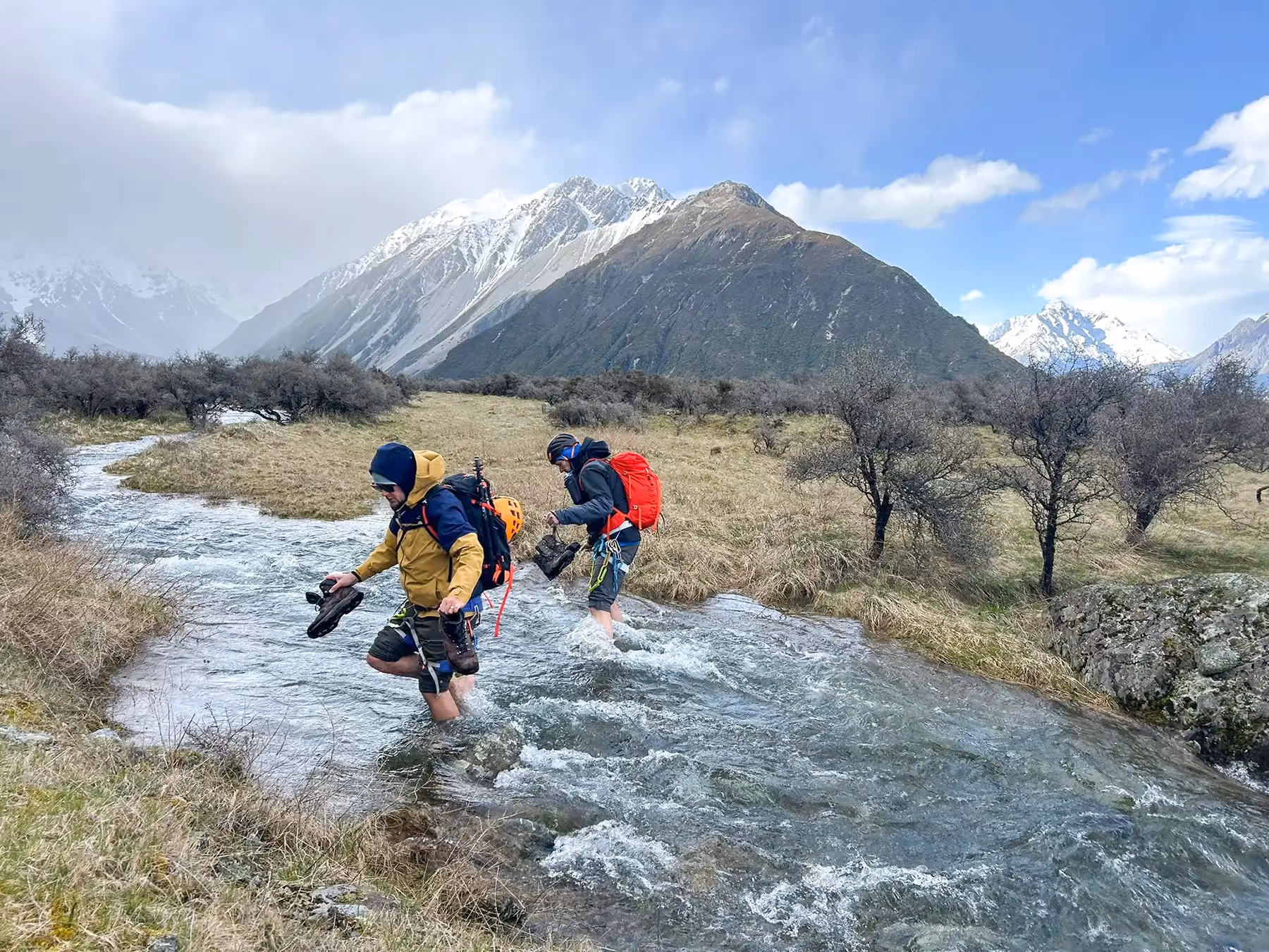 Participants crossing a stream.