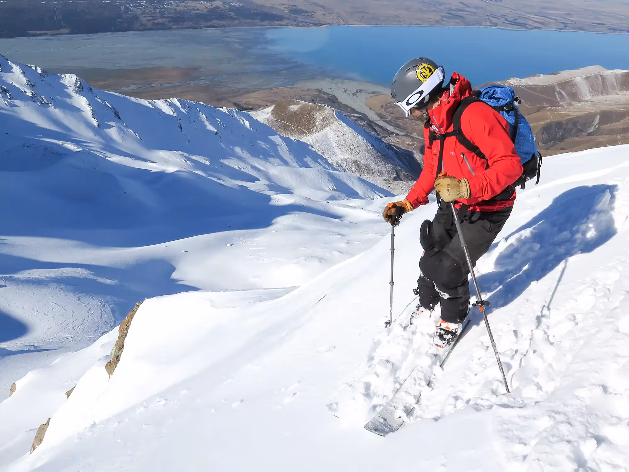 Skier surveying the terrain below before descending