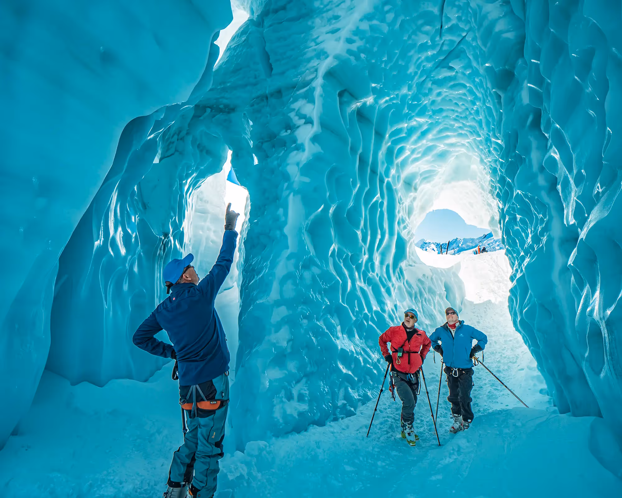 Ski The Glacier skiers exploring an ice cave