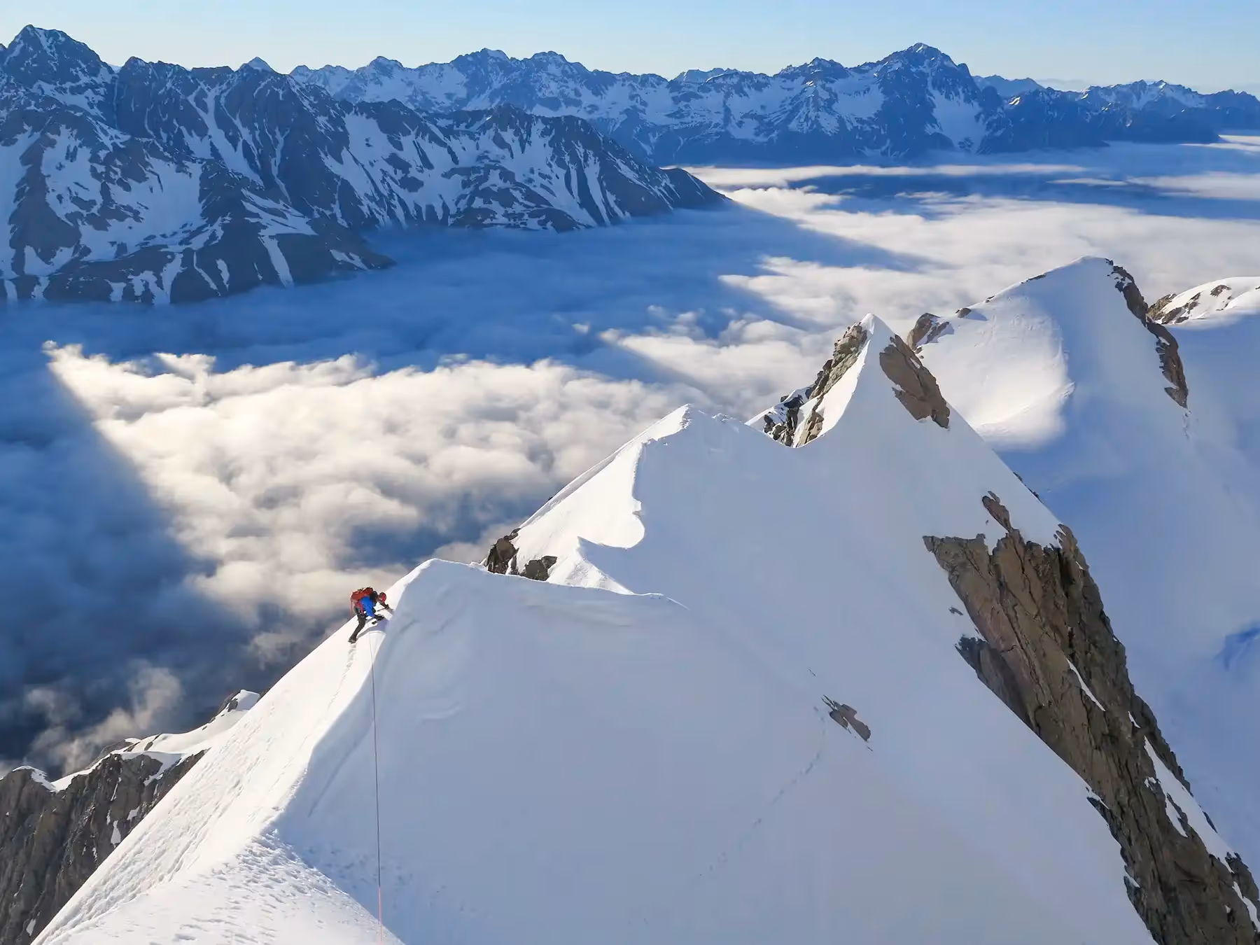 Technical Mountaineering Course climber walking along mountain ridge