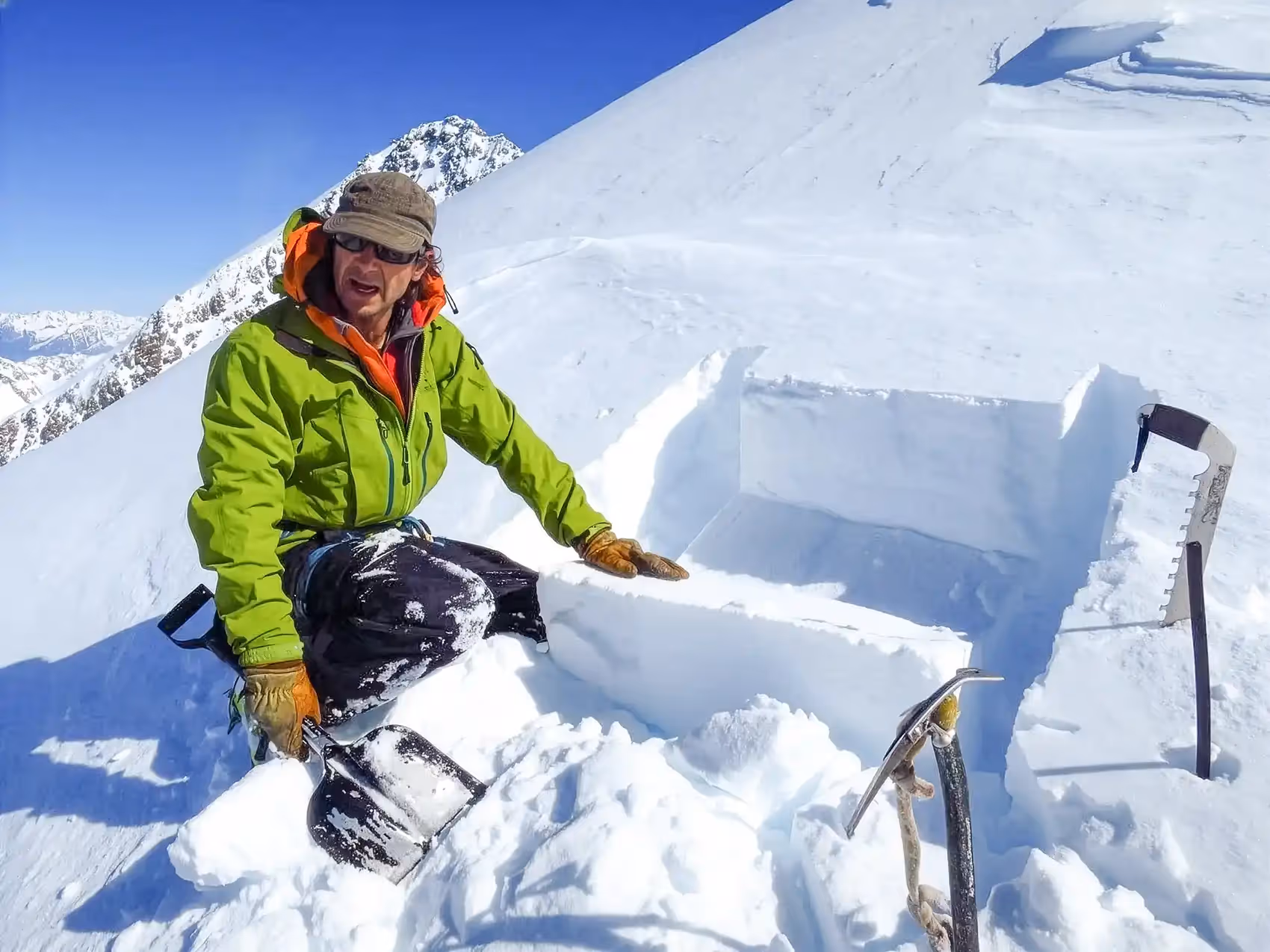 Avalanche course participant assessing snow conditions