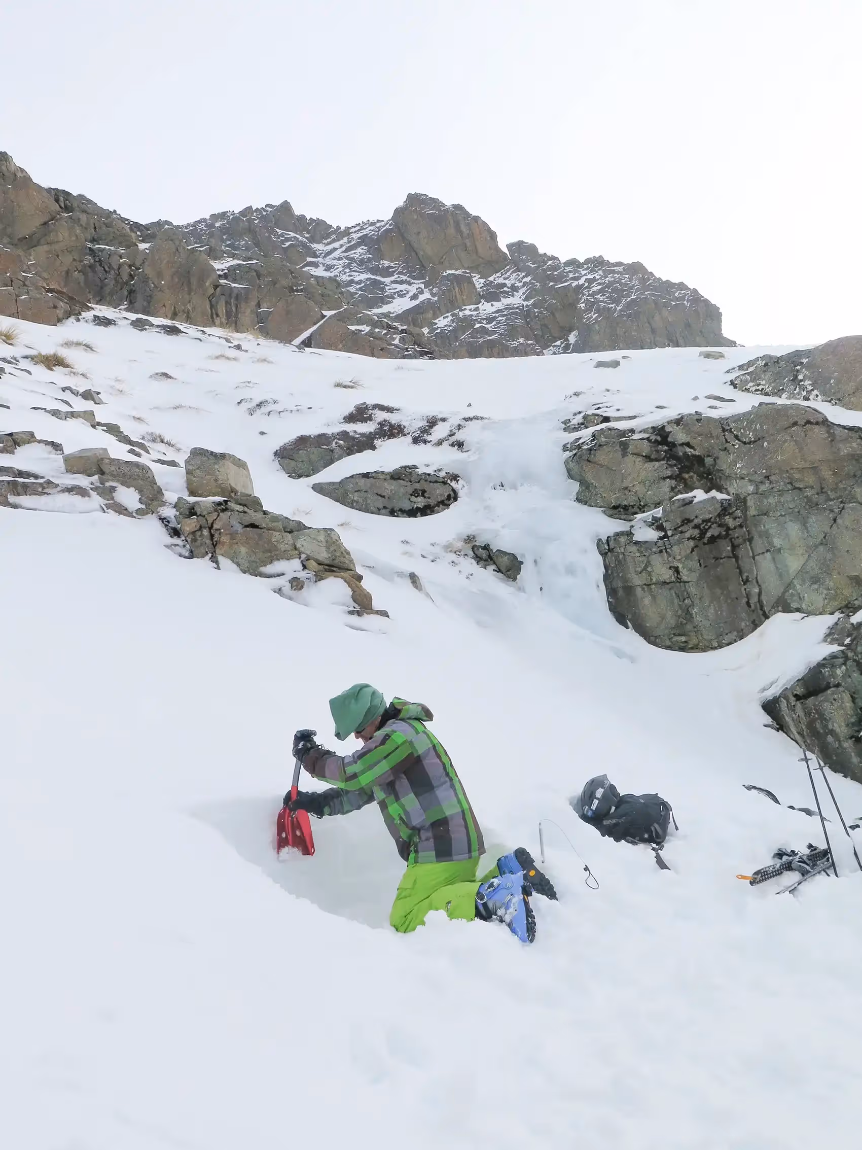 valanche course participants shovelling snow