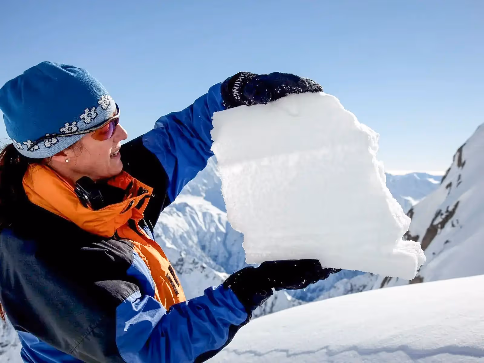 Avalanche course instructor showing a snow block
