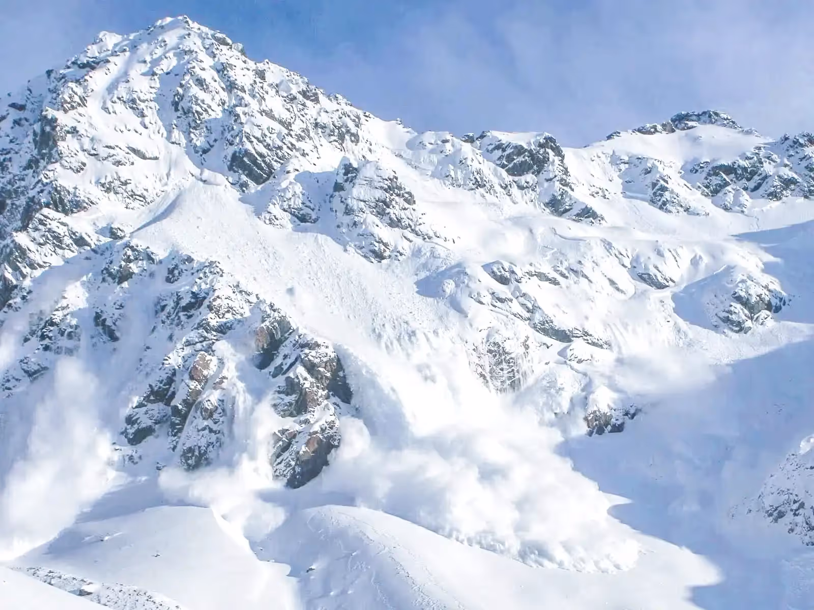 Avalanche in progress on mountain slope
