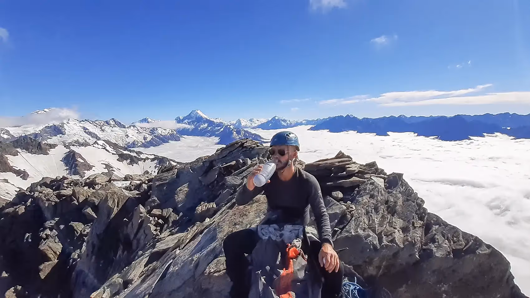 Climber on Mount Edgar Thompson summit