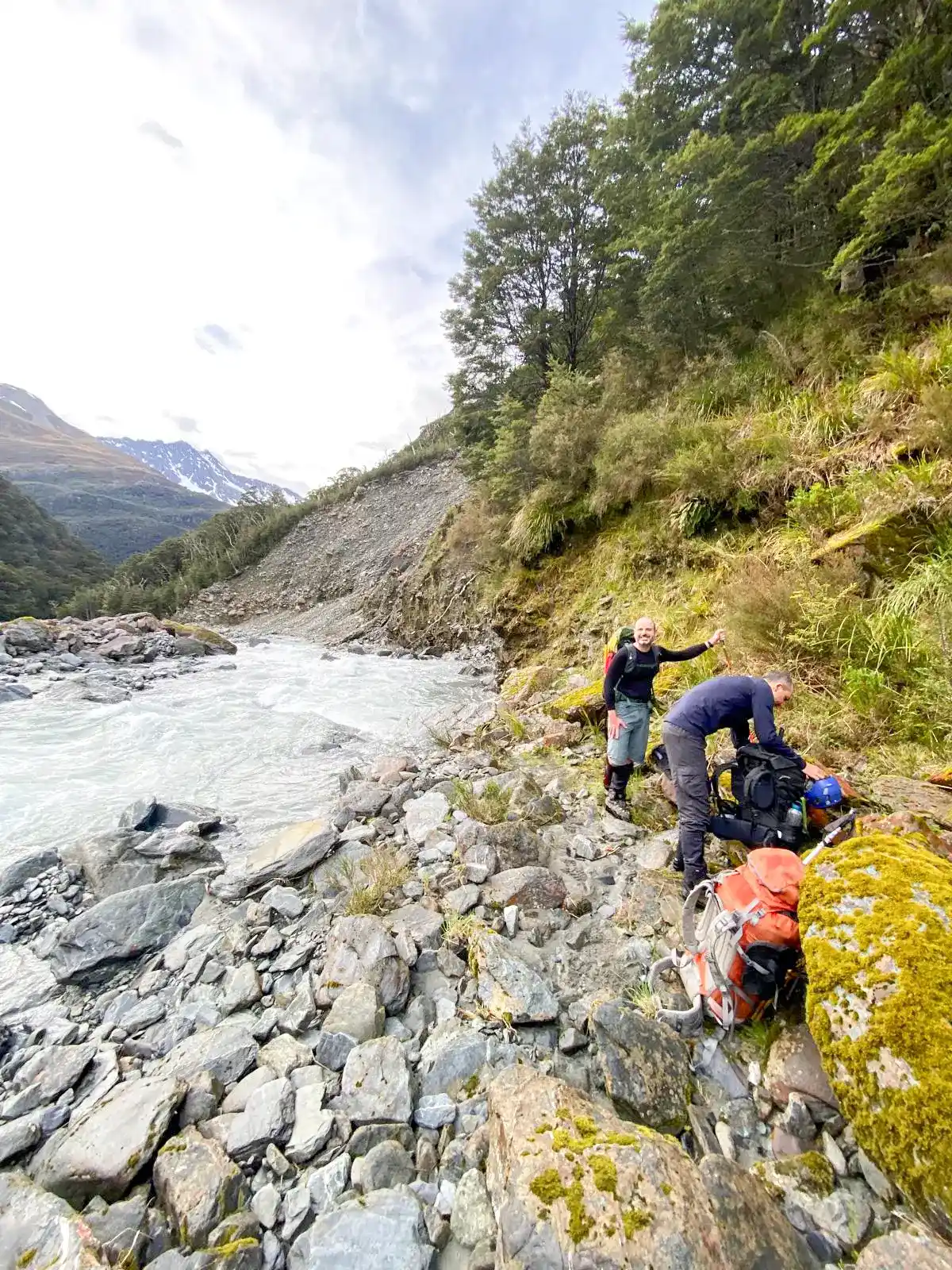 Climbers resting by riverside