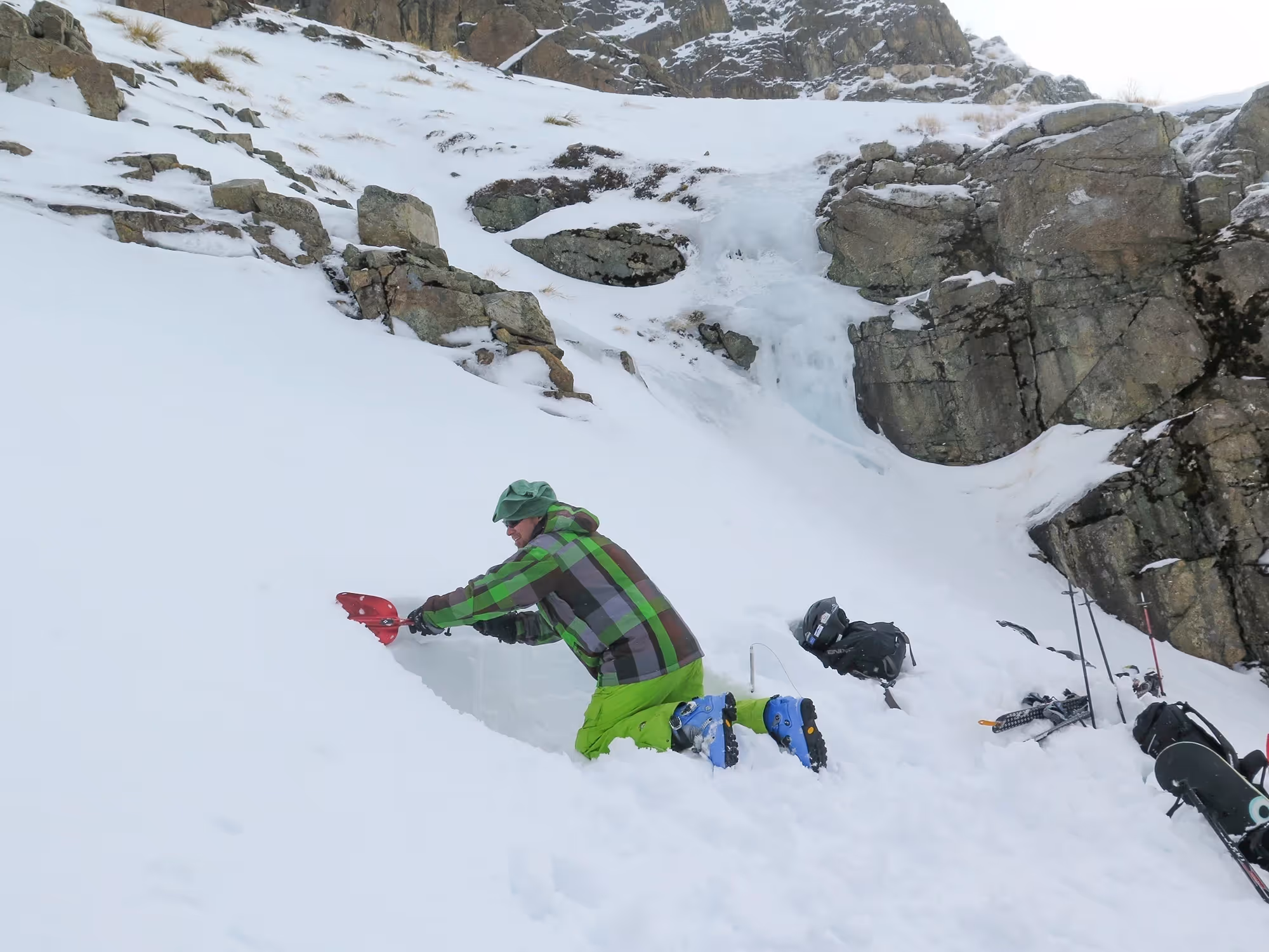 Avalanche course participant practising snowpack shovelling