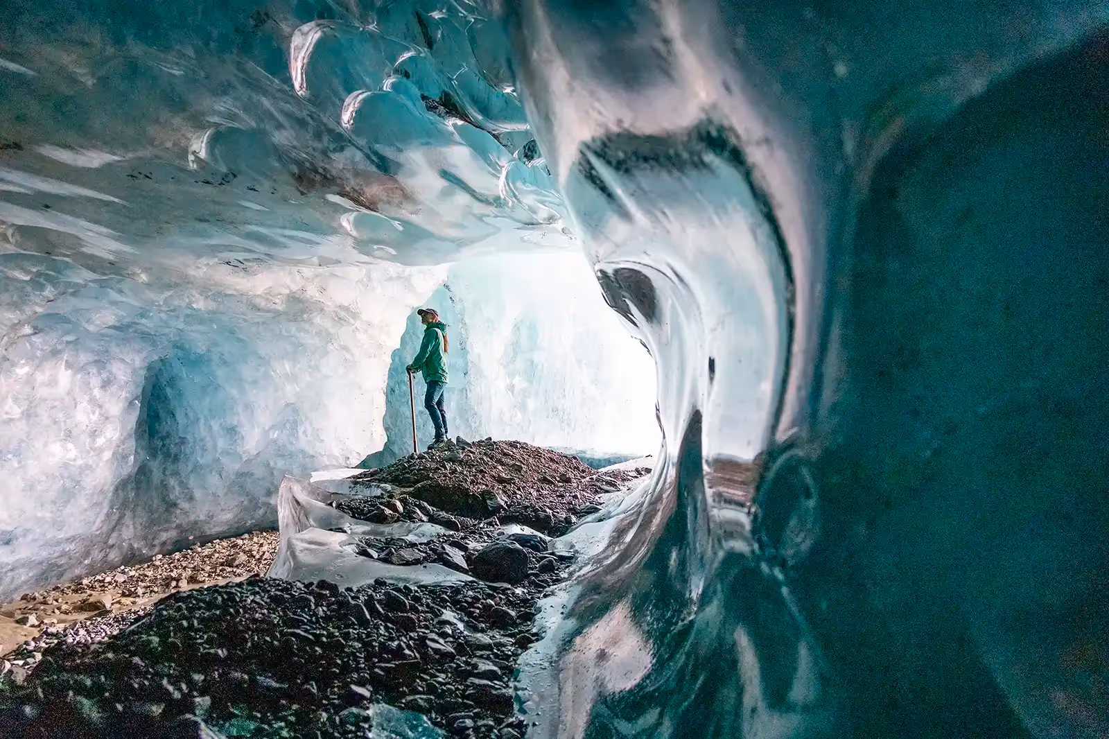 Guest exploring an ice cave on the Tasman Glacier